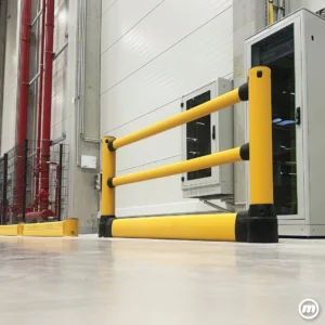 Yellow Flex GuardRail barrier installed in front of electrical cabinets, providing impact protection for sensitive equipment in a clean industrial environment.